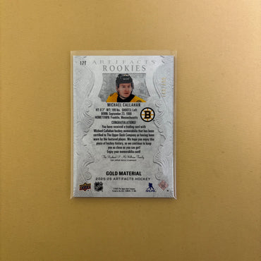 2025-26 Artifacts Bruins Michael Callahan Rookie Gold Material Dual Jersey /499 Sports Card