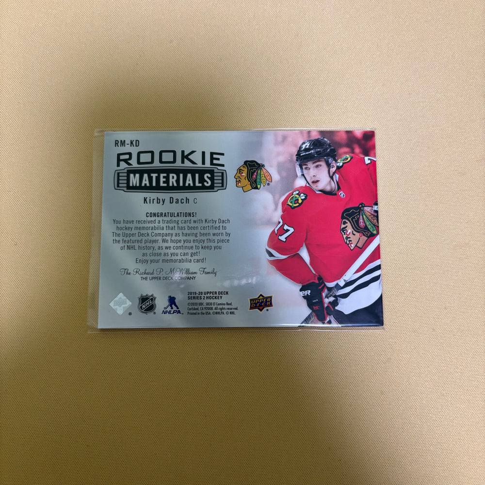 2019/20 Upper Deck Series 2 Kirby Dach Rookie Materials Jersey Chicago Blackhawks RM-KD Sports Card