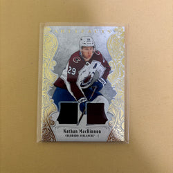 2025/26 Upper Deck Artifacts Gold Material Jersey Nathan MacKinnon /199 Colorado Avalanche #134 Sports Card